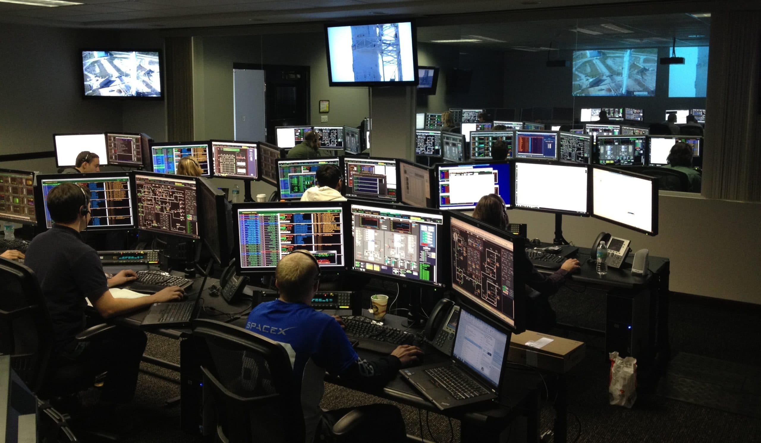 Operators at their screens in a control room